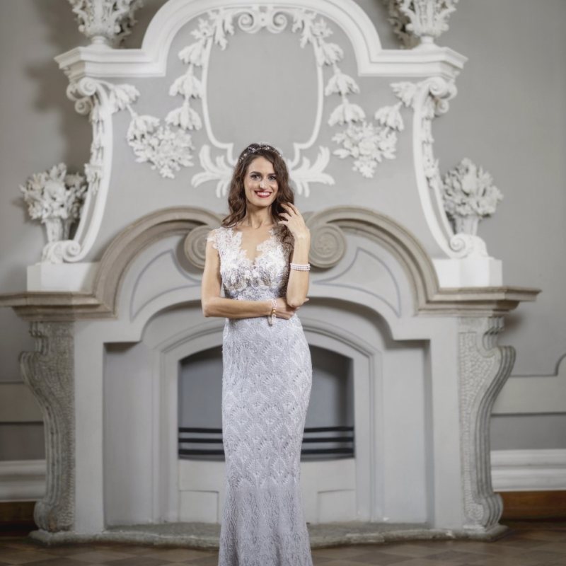 Triin Lellep — ivory gown, plaster arch